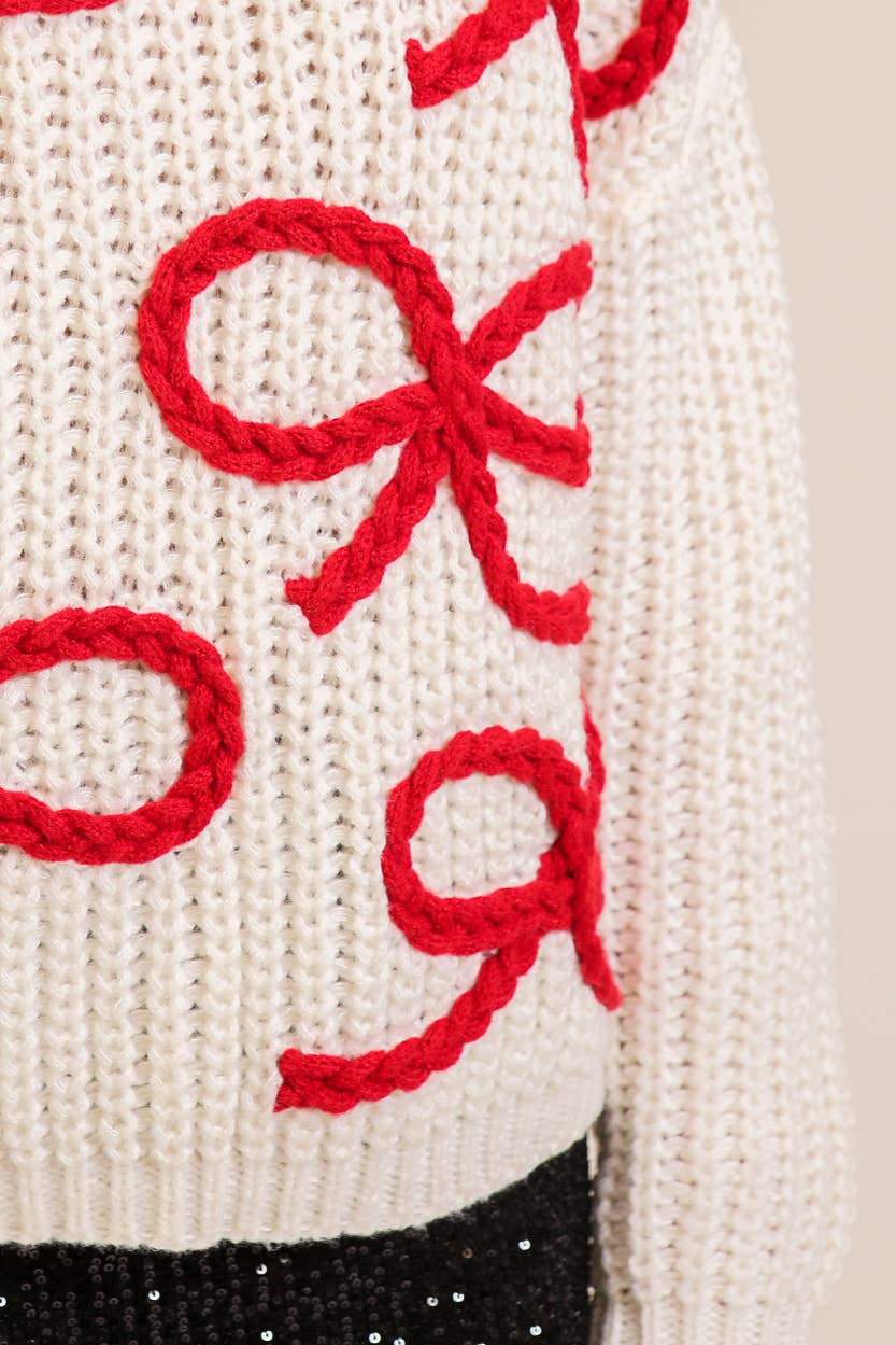 COQUETTE BOW CHRISTMAS SWEATER