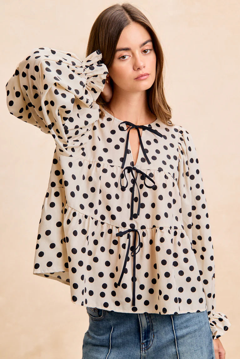POLKA DOT TIERED PEPLUM TOP WITH SHIRRING AND BOW DETAILS